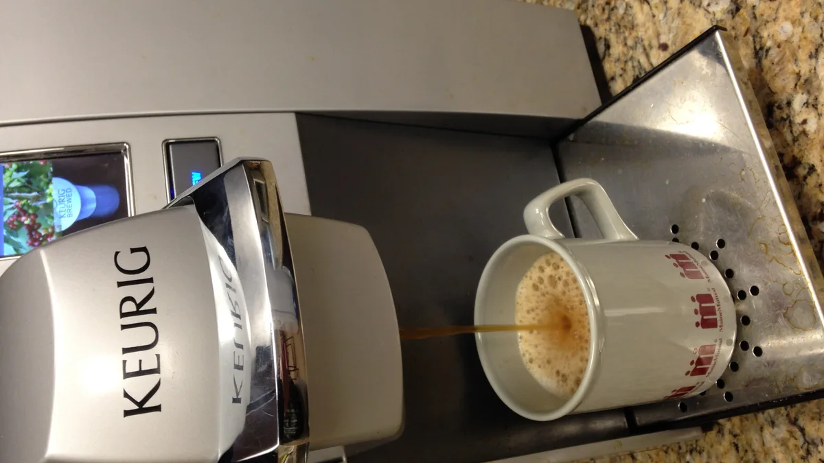 Keurig K-Cup puncture needle and pod cradle